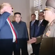A handshake turning into a salute.